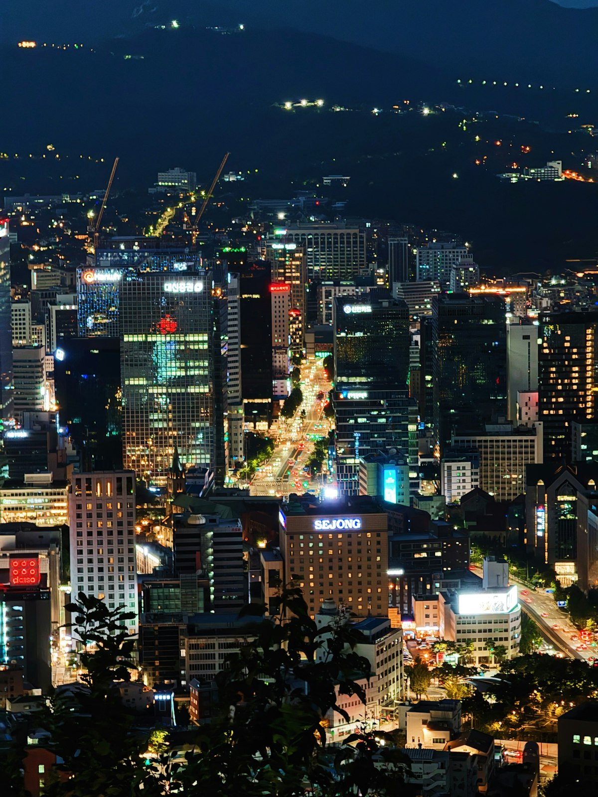 Central Seoul skyline lit up at night seen from above
