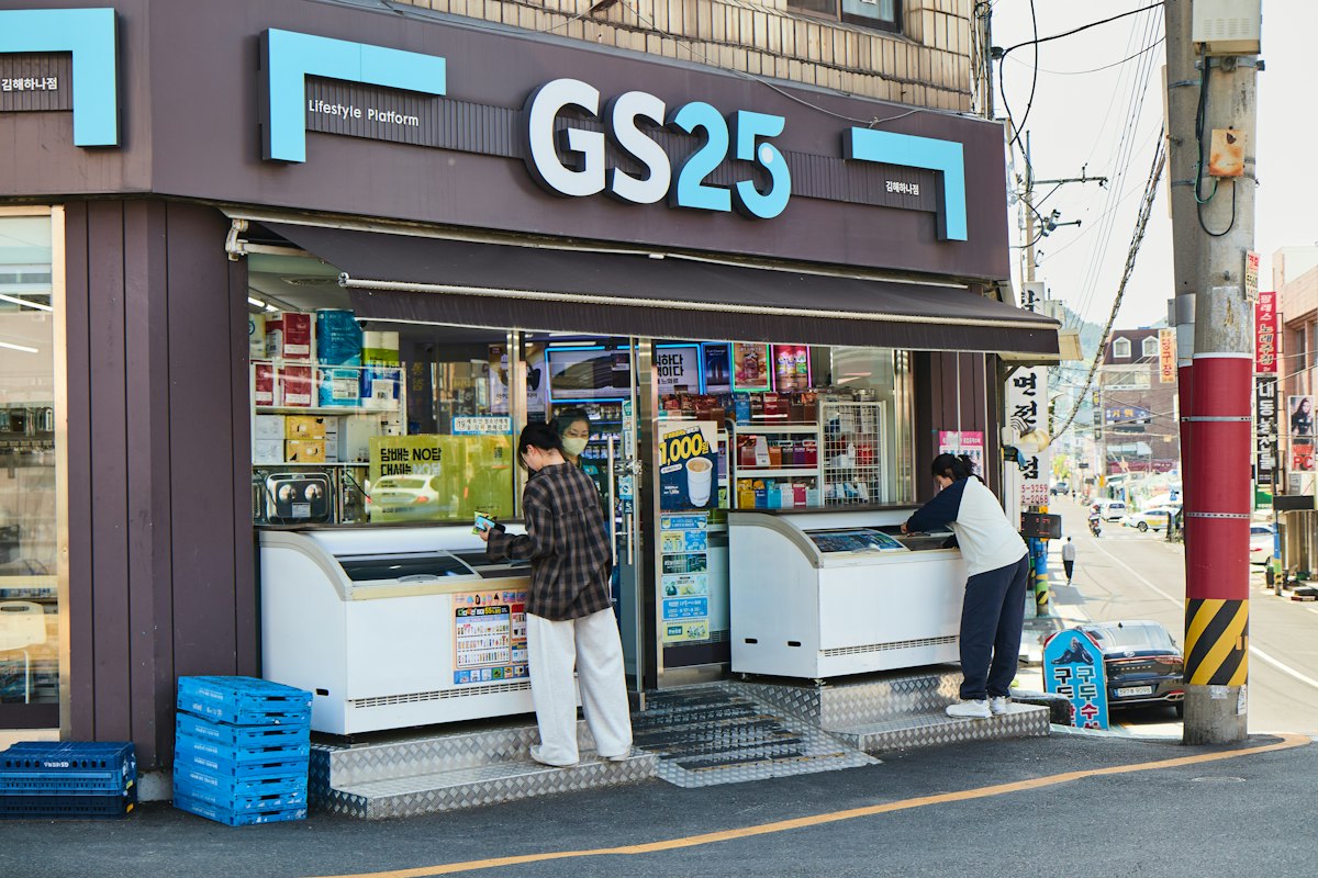 Customers at the open freezers of a GS25 convenience store in Korea