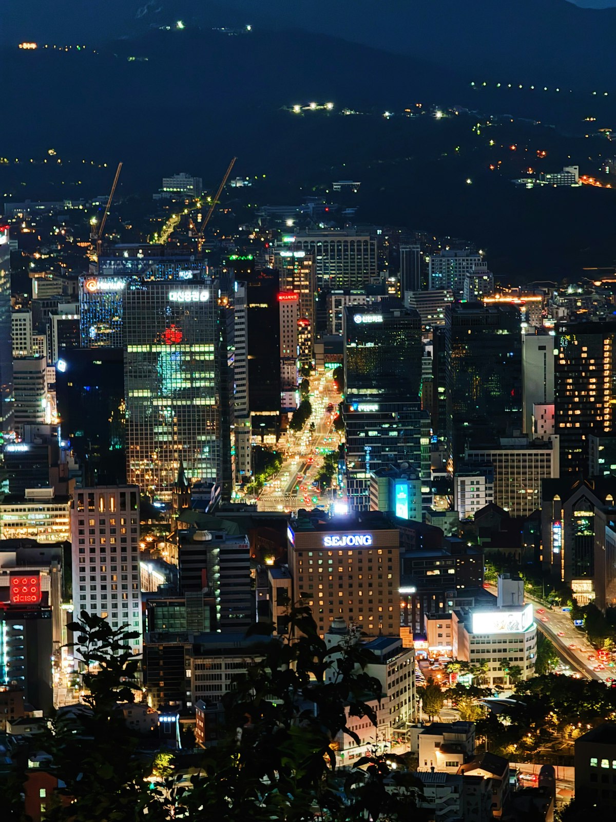 Central Seoul skyline lit up at night seen from above